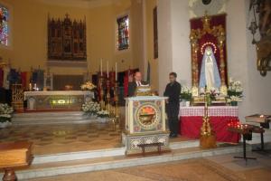 občinska proslava je bila v celoti v mestni cerkvi. Na sliki Jože Levstek med svojim govorom in Marko Zupanc, ki je poskrbel za prevod v italijanščino